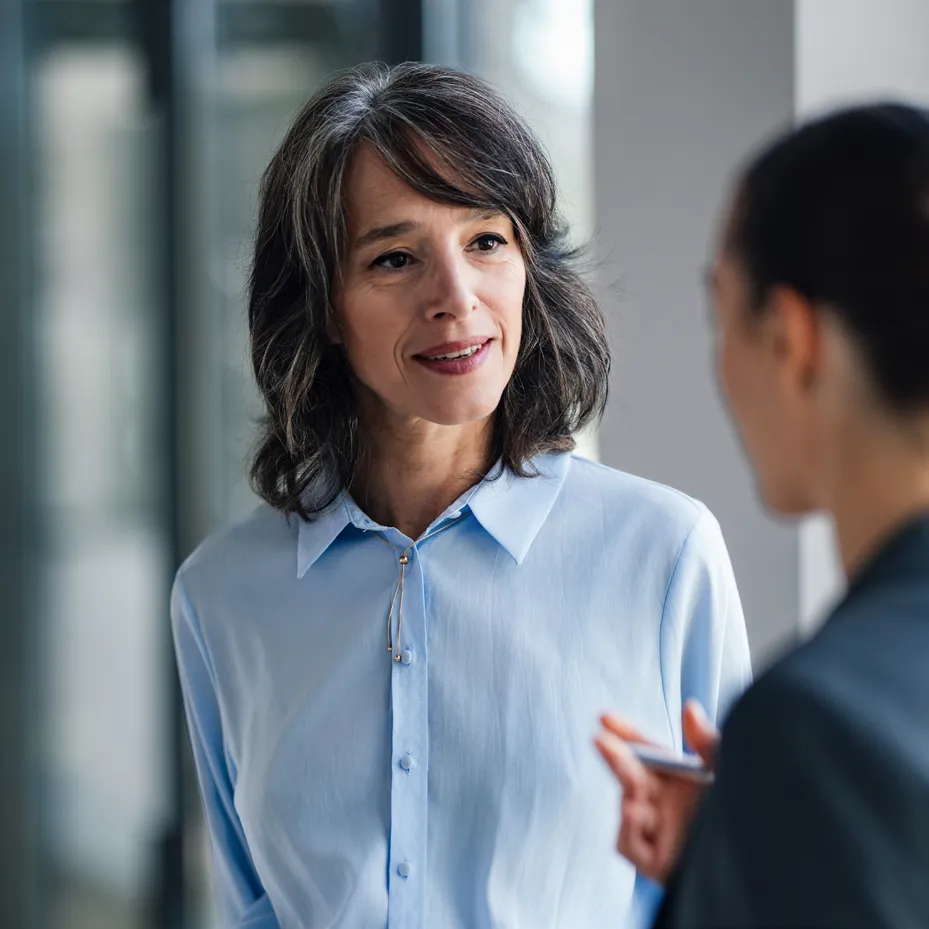 Two colleagues in conversation